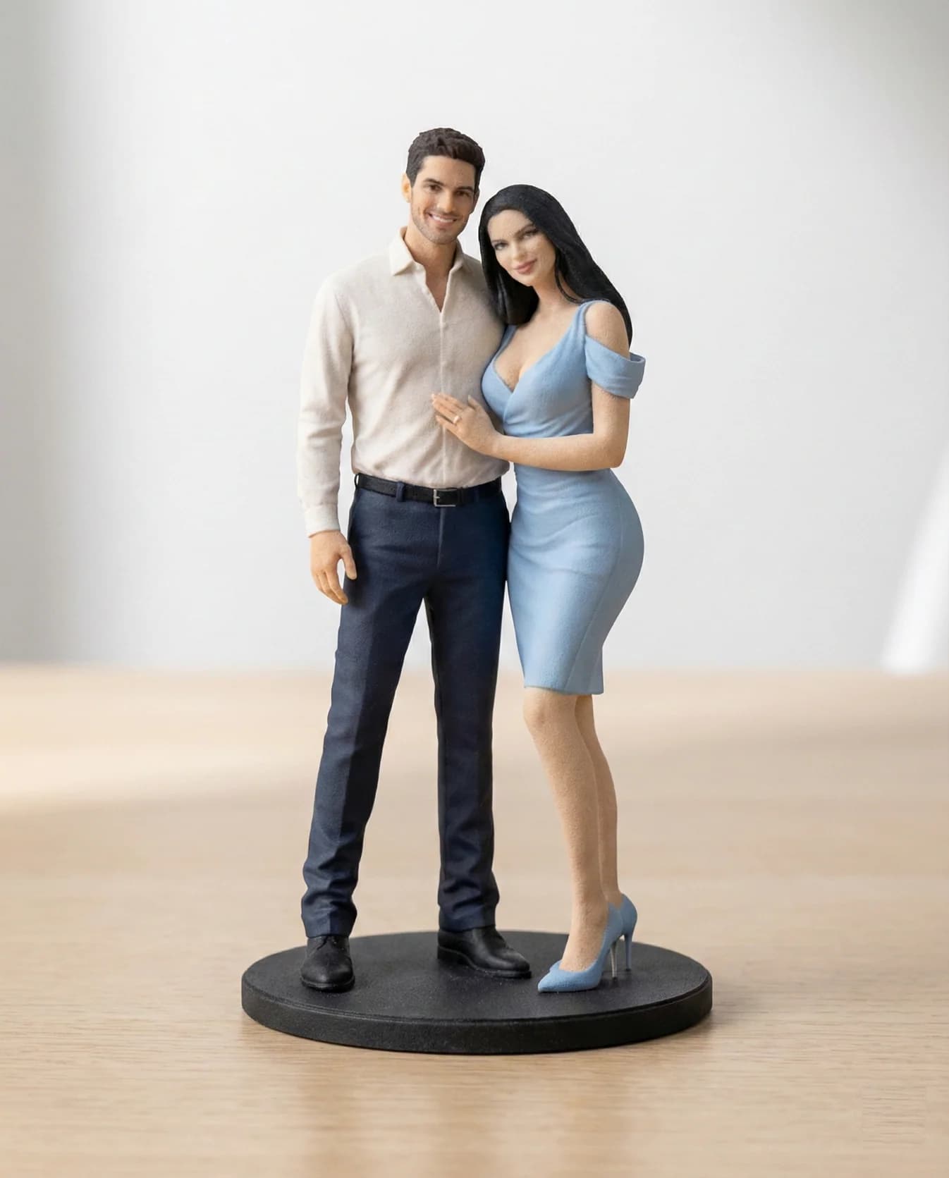 Custom couple figurine in coordinated outfits, hand airbrush-painted, standing on a wooden display base