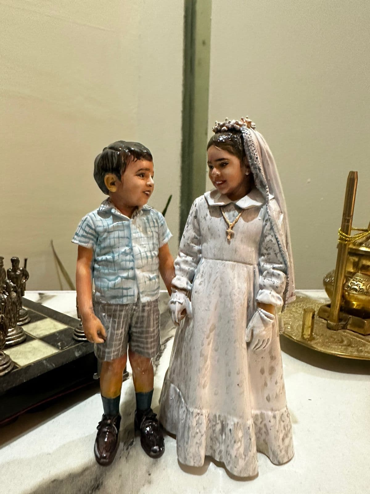 Hand-painted custom figurine of two children in formal outfits