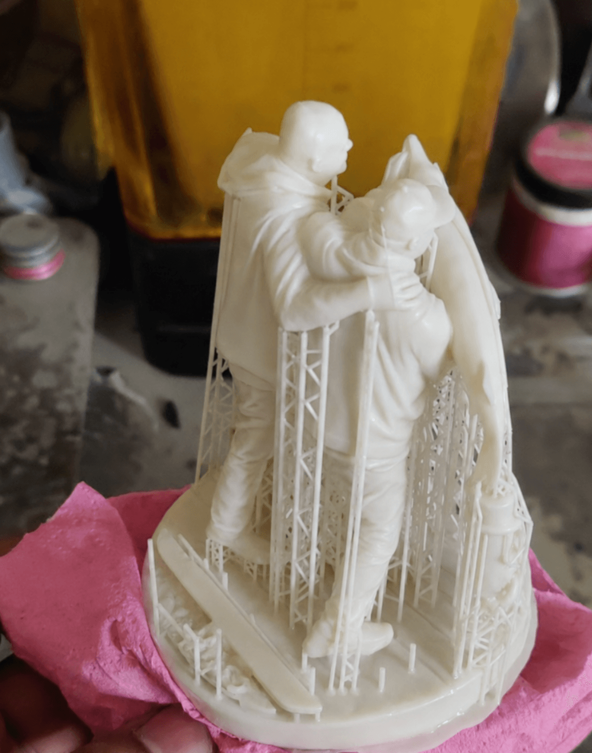 A custom figurine fresh off the 3D printer, support structures still attached